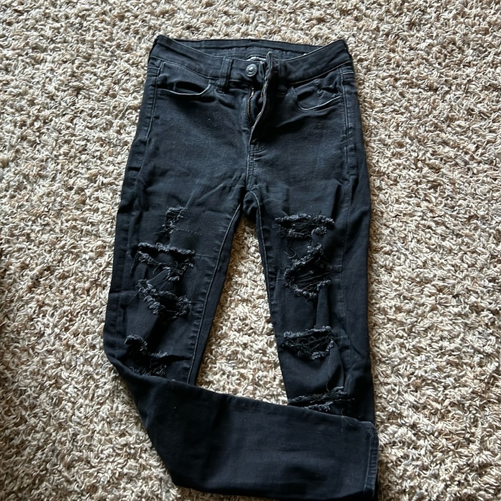 High waisted distressed black jegging